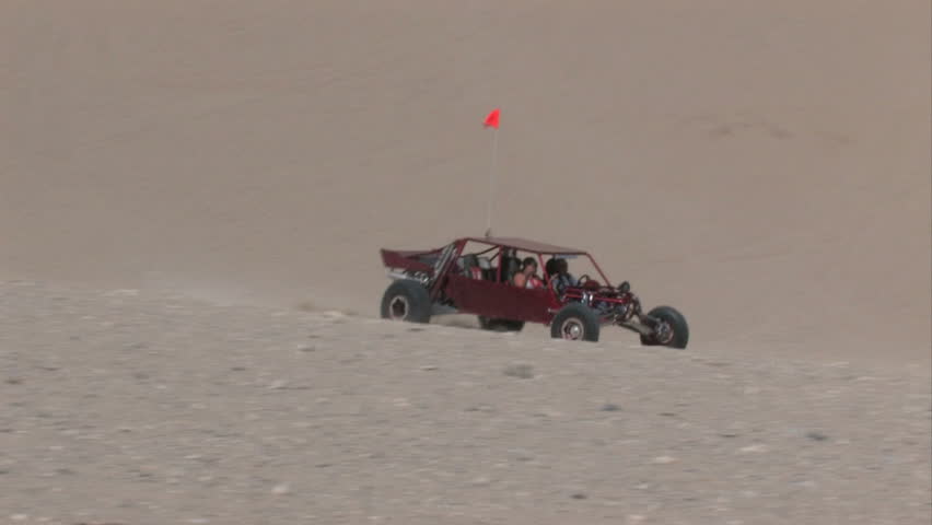 Dune buggy climbing Sand Mountain in the Little Sahara recreation area in Utah.  700 vertical feet of sand used for off road vehicles, fun and recreation.  Central Utah.