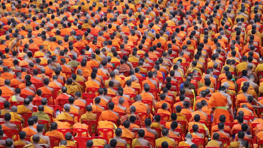 BANGKOK - MARCH 25: Monks are participating in a Mass Alms Giving of 12,600 monks in Central World for the Makha Bucha celebrations on March 25, 2012 in Bangkok, Thailand.