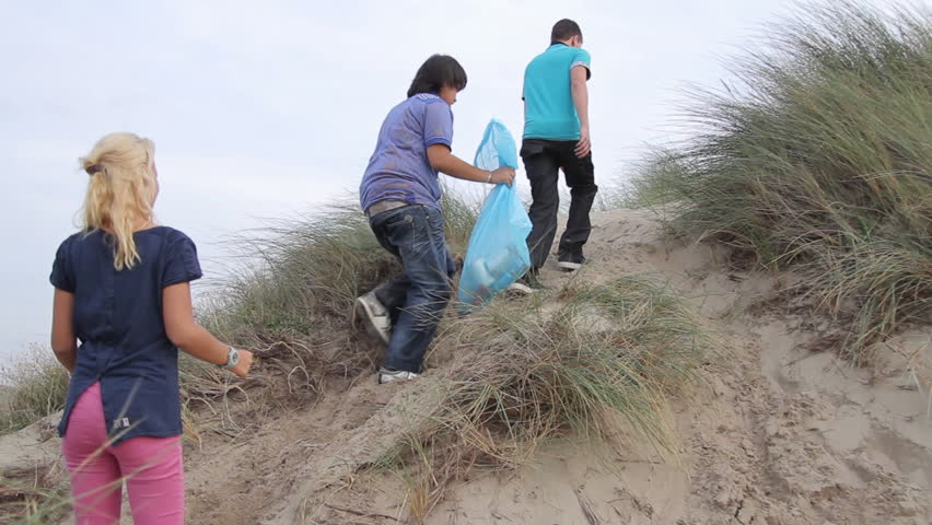 Teenagers Volunteering Beach Cleanup