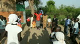BOR, SUDAN - DECEMBER 3: Children from the Dinka tribe dance and sing at church shortly before independence on December 3, 2010 in Bor, South Sudan. Christians are persecuted by the Islamic regime of Sudan.