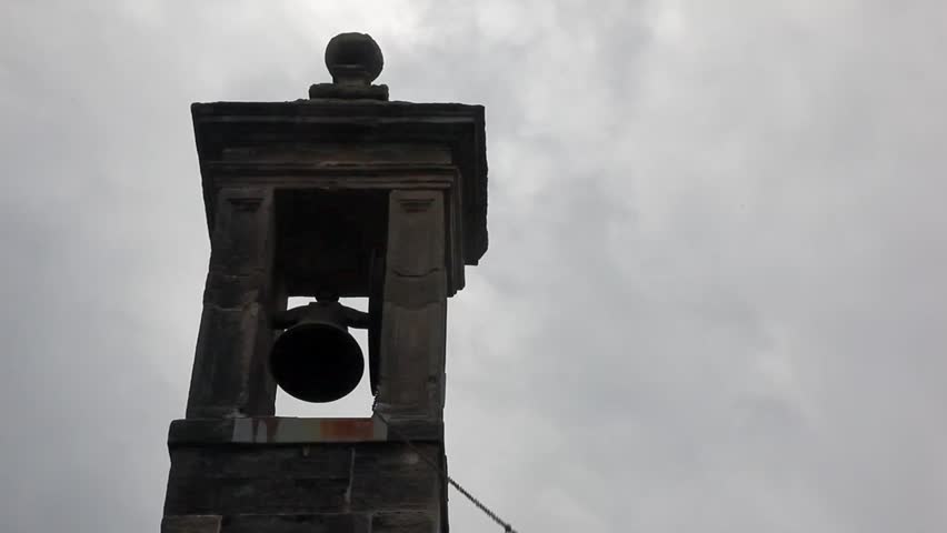 A bell tower overlooking a cemetery in Scotland