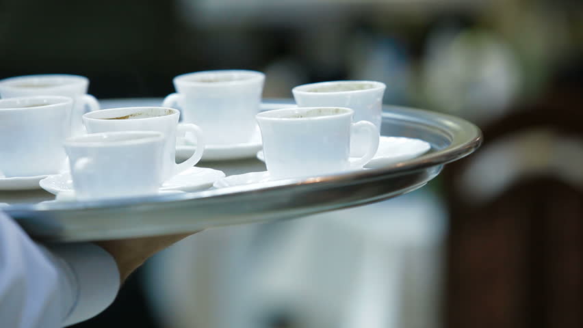 Waiter serving coffee