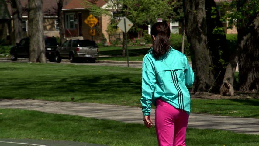 Young girl practicing basketball