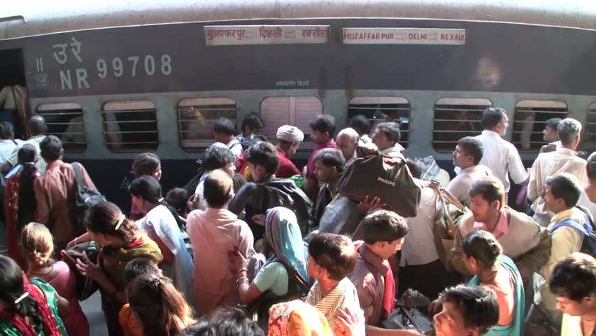 DELHI - NOV 13: People waiting for their trains in the Delhi Junction Railway Station on November 13, 2011 in Delhi, India. Delhi Junction is the oldest railway station of Delhi city.