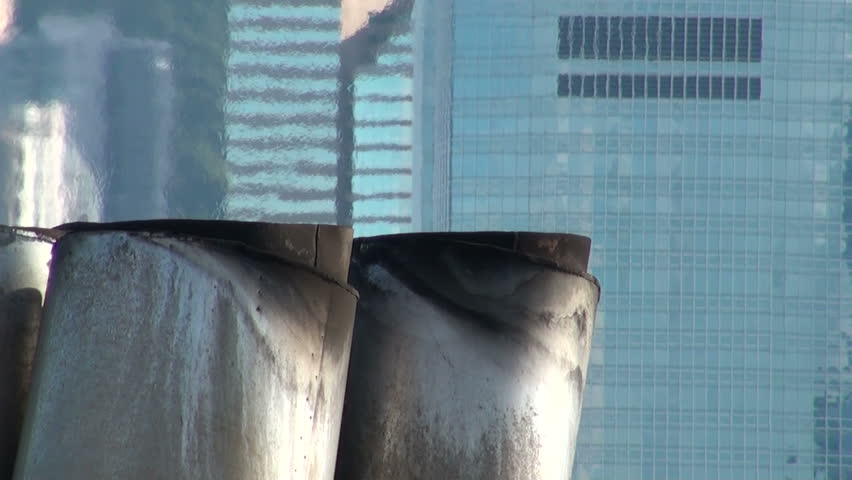 Exhaust fumes come from the pipe of a cruise ship