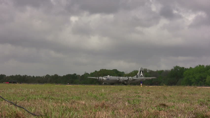 World War II era heavy bomber taxiing in the haze