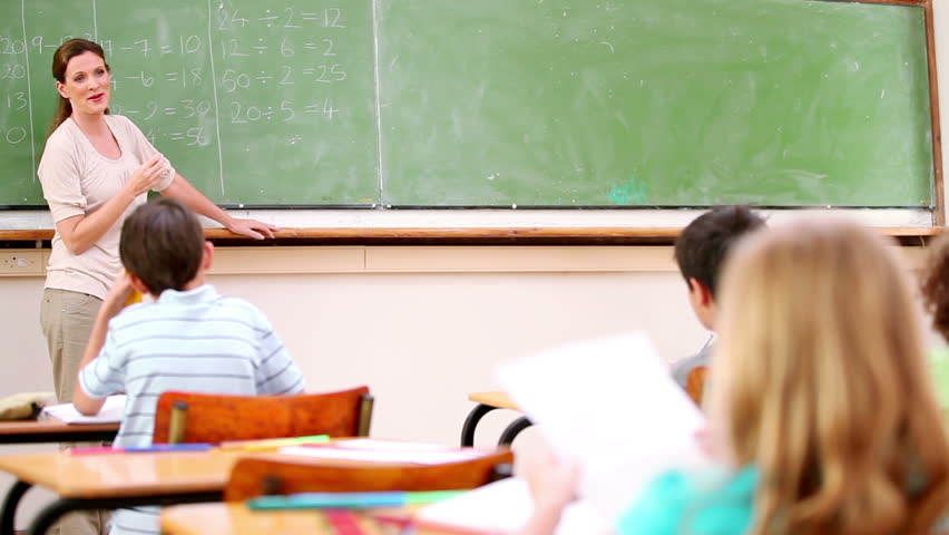 Pupil raising his ruler in the classroom