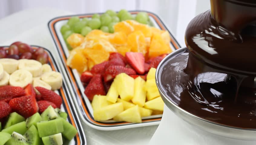 Flowing chocolate in chocolate fountain