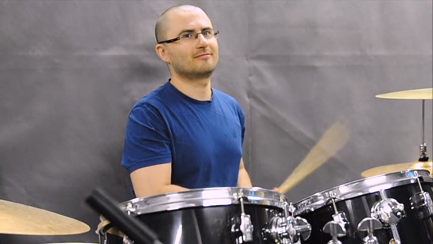 drummer plays the drums