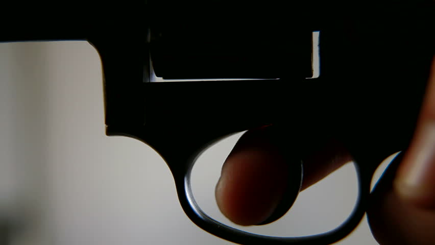 Press a finger on the trigger, closeup