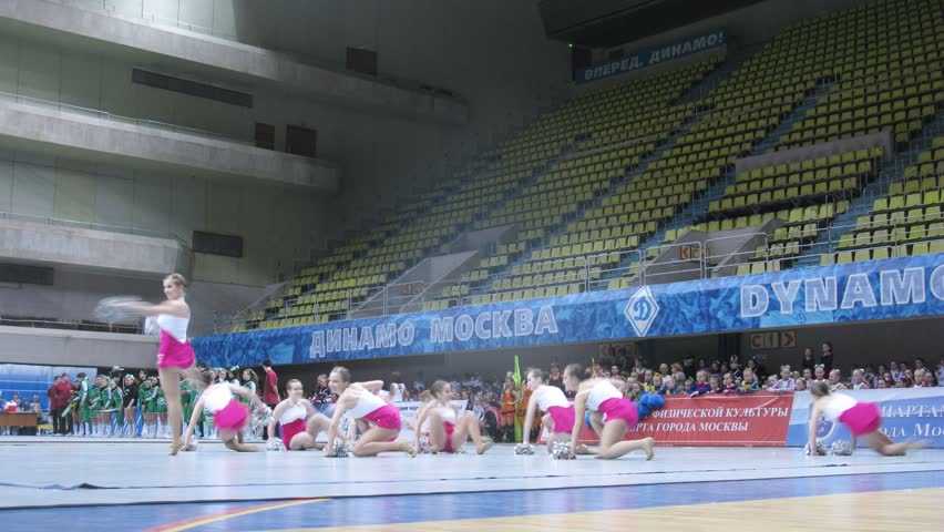 MOSCOW - MAR 24: (Timelapse View) Team in rose-white suits participate in participates in competitions of Championship of Moscow on cheerleading in Dynamo sports palace, on March 24, 2012 in Moscow