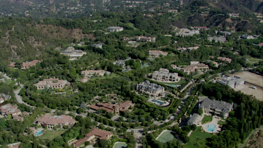 aerial view of upscale suburban homes on large lots with lush landscaping circa 2009