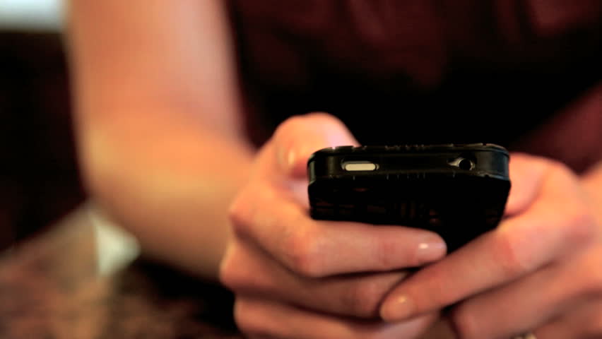 close up of woman texting