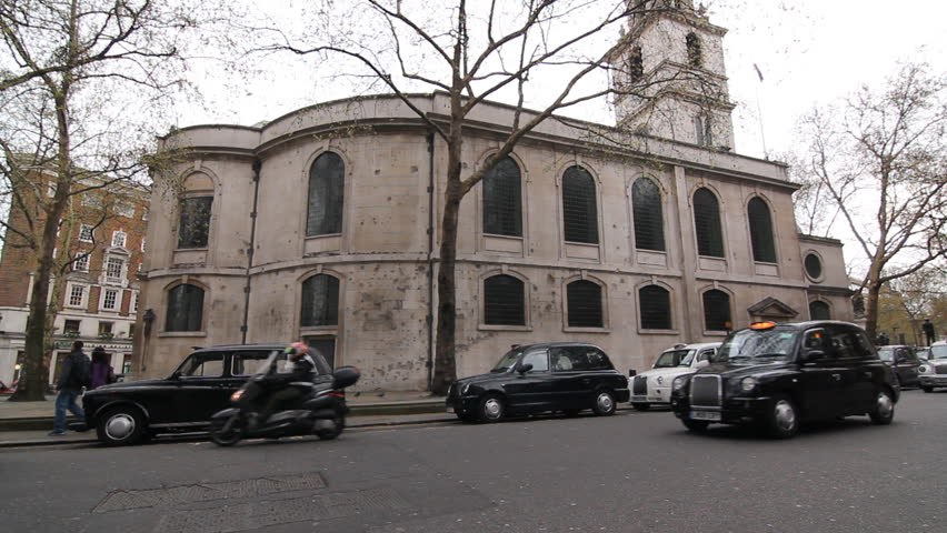LONDON, UK APRIL 4th: London cabs outside St Clement Danes church on April 4th, 2012 in London, England. St Clement Danes functions as the central church of the Royal Air Force. 