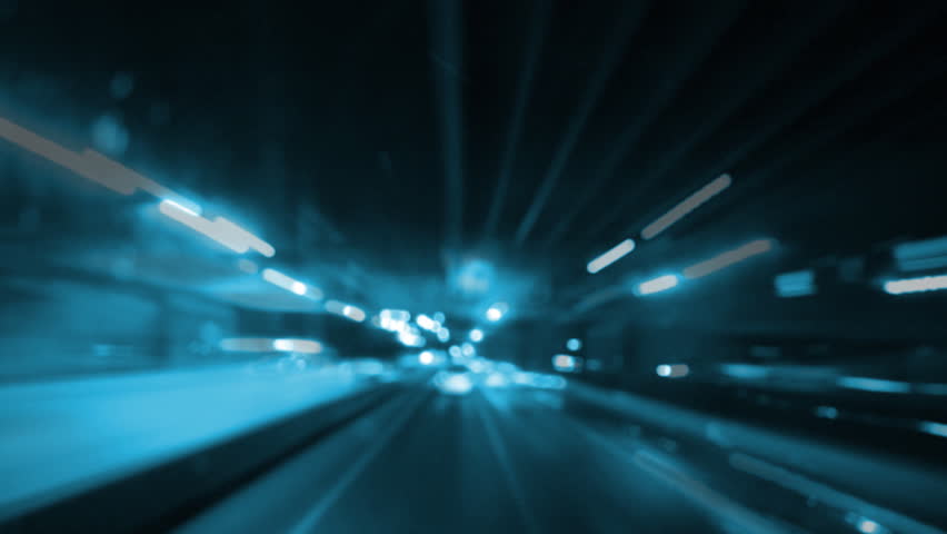 Driving at high speed through the streets, out of time timelapse blue light.