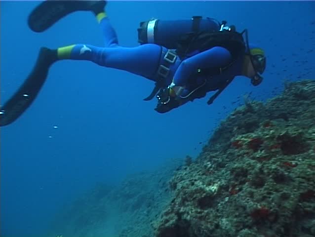 Underwater scene: Diver. Shot captured in the wild in the Mediterranean Sea (Italy) by 3CCD camcorder. 