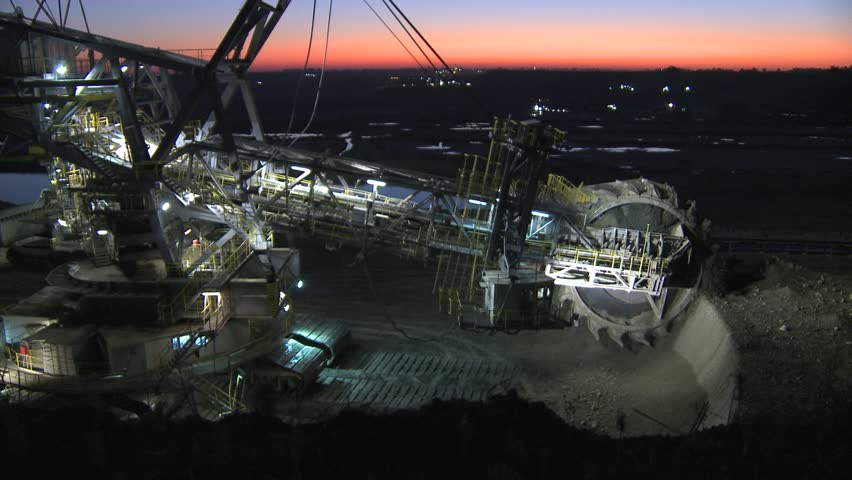 excavator pit mine at night