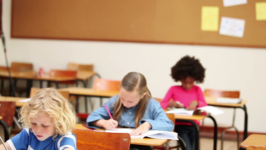 Pupils working quietly in the classroom