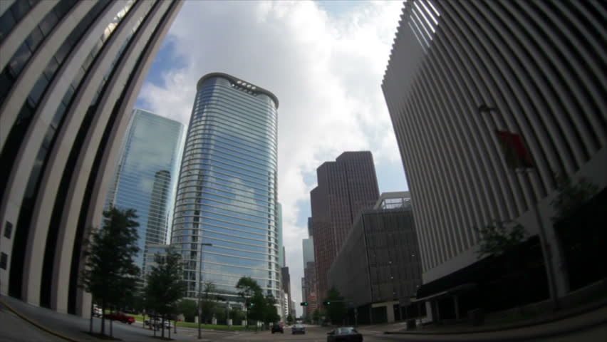Driving down one of the streets of downtown Houston, TX the fisheye lens distorts the skyscrapers making them twist and bend.
