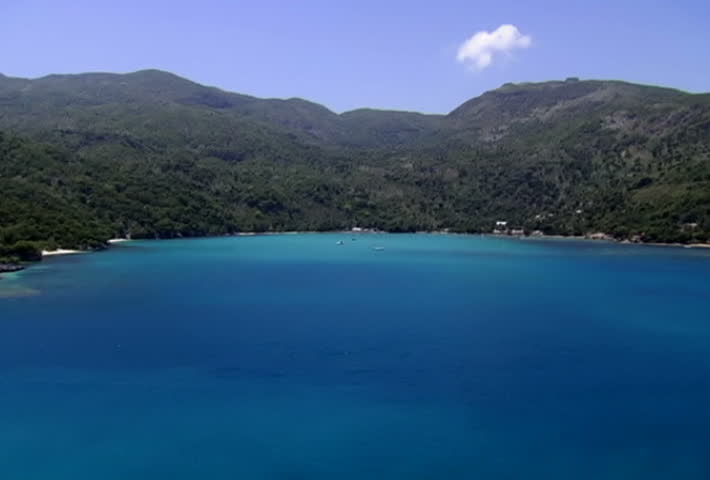 Zoom in to a bay. Various water activities, kayaking, boating, sailing and tourist tours.