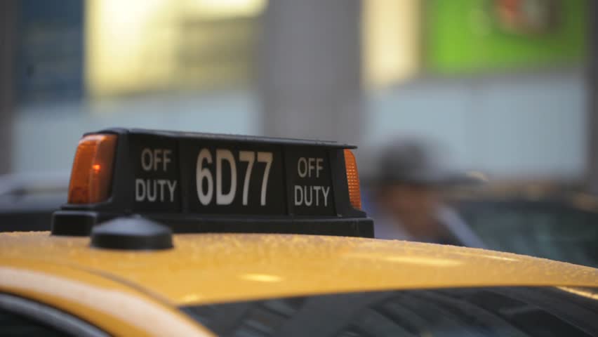 New York - Circa 2009: New York traffic in 2009. A taxi cab top off duty light blinking in New York CIty, New York.