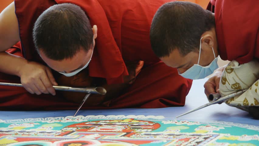 NOVOSIBIRSK - CIRCA APRIL 2012: Tibetan monks making sand mandala circa April 2012 in Novosibirsk, Russia.