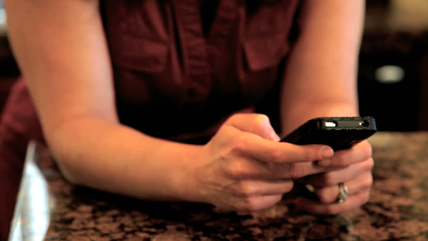 Woman texting looking happy then angry