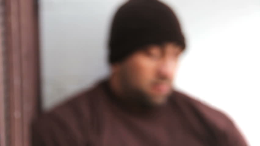 Homeless man watching events around him