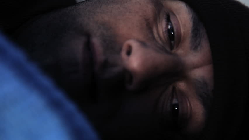 Homeless man trying to sleep at night