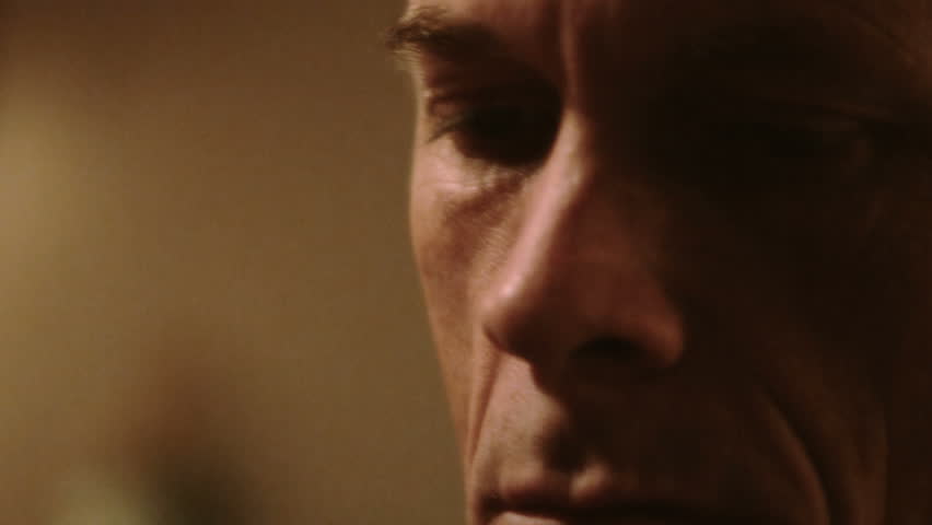 close up of man with deeply lined features with a focused look
