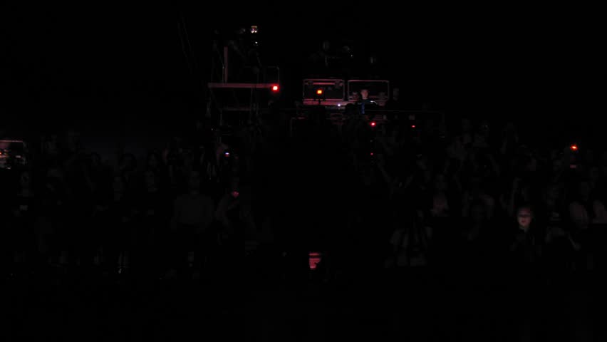 MOSCOW - APR 8: (Timelapse View) Feet of visitors move in front of sitting photographers in dark on VOLVO - Week of fashion in Moscow in Gostini dvor, on April 8, 2012 in Moscow, Russia