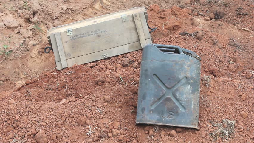 Empty Surplus Crate Tossed With Empty Crate And Metal Can