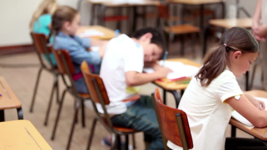 Serious pupils working in the classroom