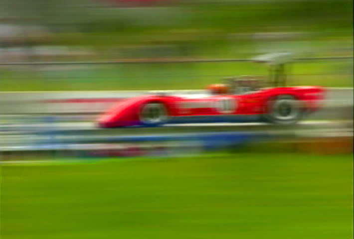 ELKHART, WISCONSIN - CIRCA JUNE 1996: Unidentified sports car races at the Chicago Historics event on the Road America race track in Elkhart, Wisconsin circa June 1996.