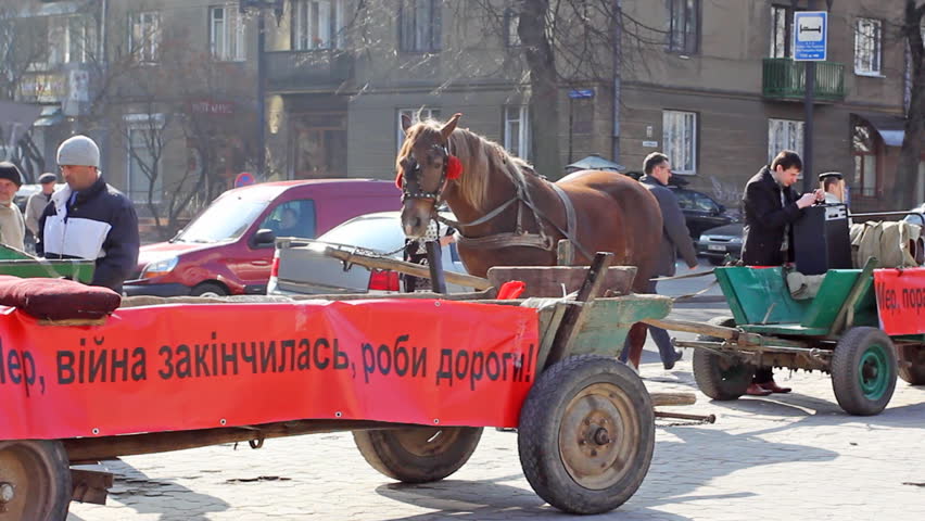 IVANO-FRANKIVSK, UKRAINE - MARCH 23: Protest near Administration against bad roads on March 23, 2012 in Ukraine, Ivano-Frankivsk. Inscription on posters with requirements for mayor to repair roads