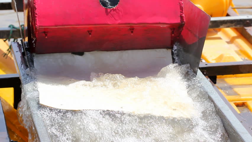 Suction dredge mining placer gold deposits on the Rio Napo in the Ecuadorian Amazon.