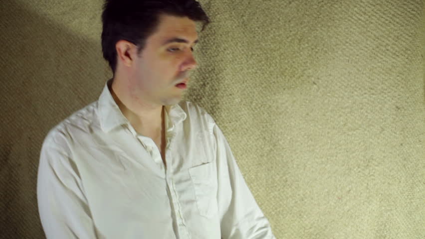 Man looking at a lamp, wish concept