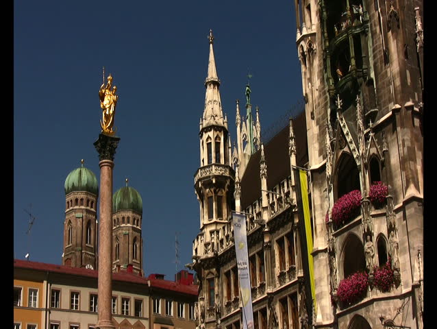 Statue of St Mary with the two towers of Frauenkirche, Church of Our Lady in Marienplatz Munich Bavaria Germany