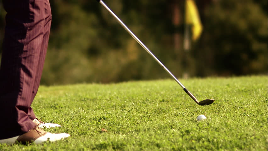 A man playing golf