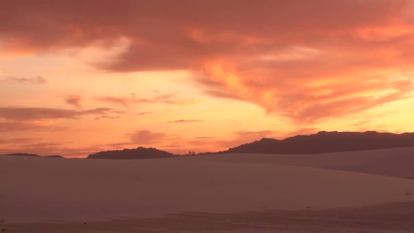 Time Lapse, Photographer videotapes striking sand dune sunset. 1080p