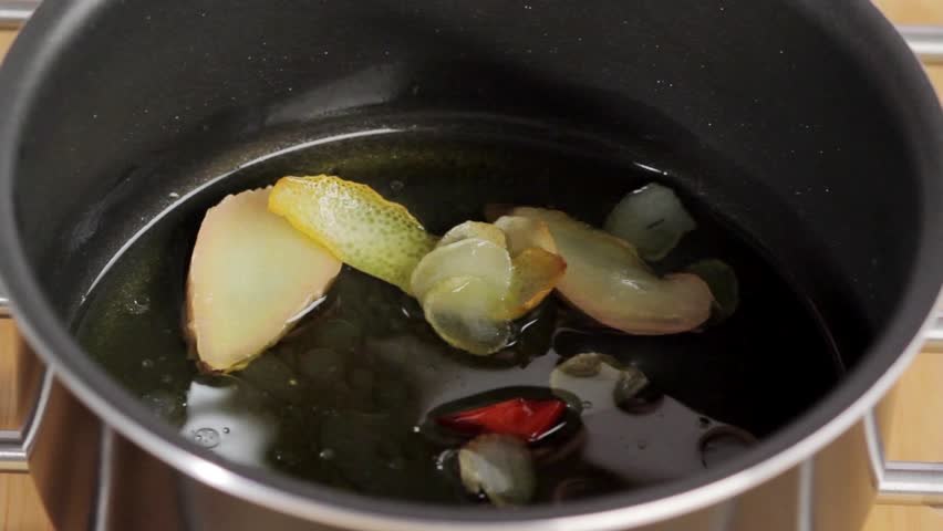 Adding lemon juice to the ginger, lemon zest, chilli and oil