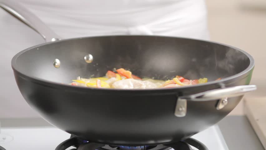 Mange tout being added to chicken curry