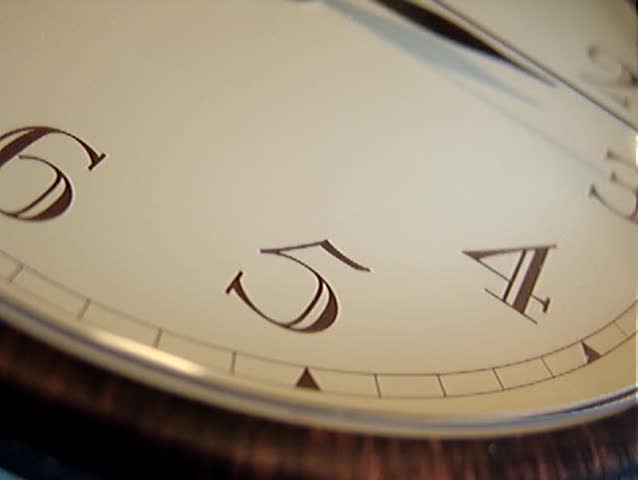 Time is running out!  Close-up view of a huge wall clock focused on the fifteen minutes arm movement. (Excellent web introduction footage - can be looped continuously!)