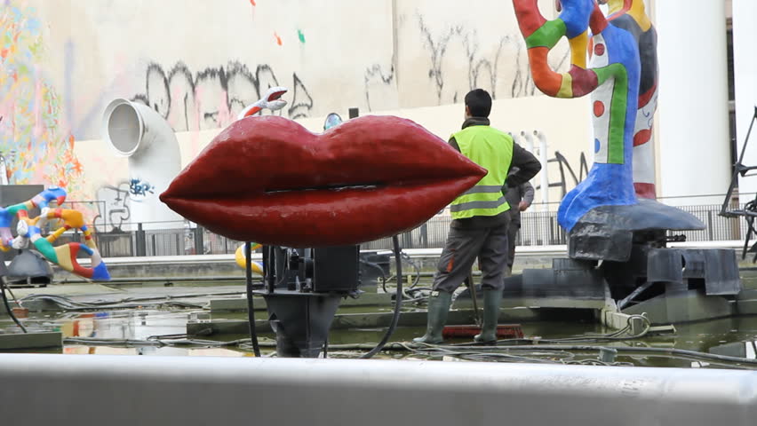 PARIS, FRANCE â APRIL 8th: Cleaning the Stravinsky fountain in Paris on April 8th, 2012. Close to the George Pompidou center the fountain sculptures were inspired by Igor Stravinsky's works.