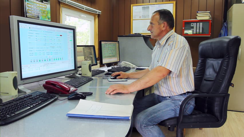 adept engineer work on computer with three monitors