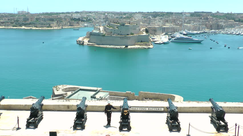 VALLETTA, MALTA - JUNE 8: The Malta Noon Day Cannon Gun Firing in Valletta, Malta on June 8, 2012.  The Malta Noon Day Gun, originally started in the year 1566, was used as a time signal for the city.