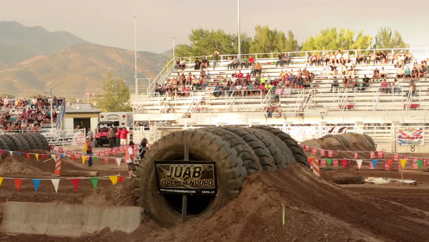 NEPHI, JUAB, UTAH 30 JUN 2012: Motorcycle enduro race tire jump. Juab County extreme enduro drawn visitors to rural community adding to needed economic stability. Difficult obstacle course.