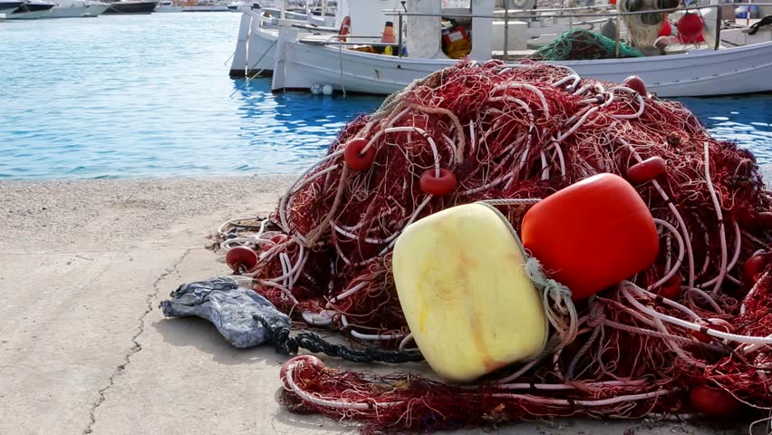 Balearic islands formentera port with trammel fisher nets buoys and fishingboats in background