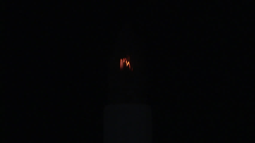 A faint Christmas tree light.