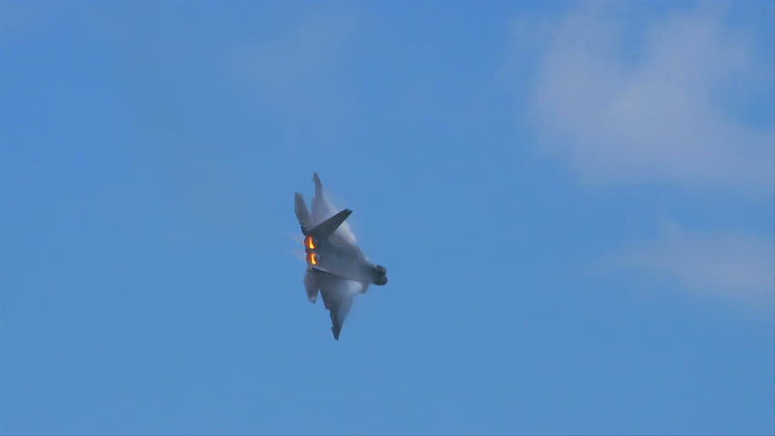 QUONSET, RHODE ISLAND - JUNE 2012: Air force F-22 Raptor with vapor on wings and after-burners at the Rhode Island National Guard Open House and Air Show in June 2012.